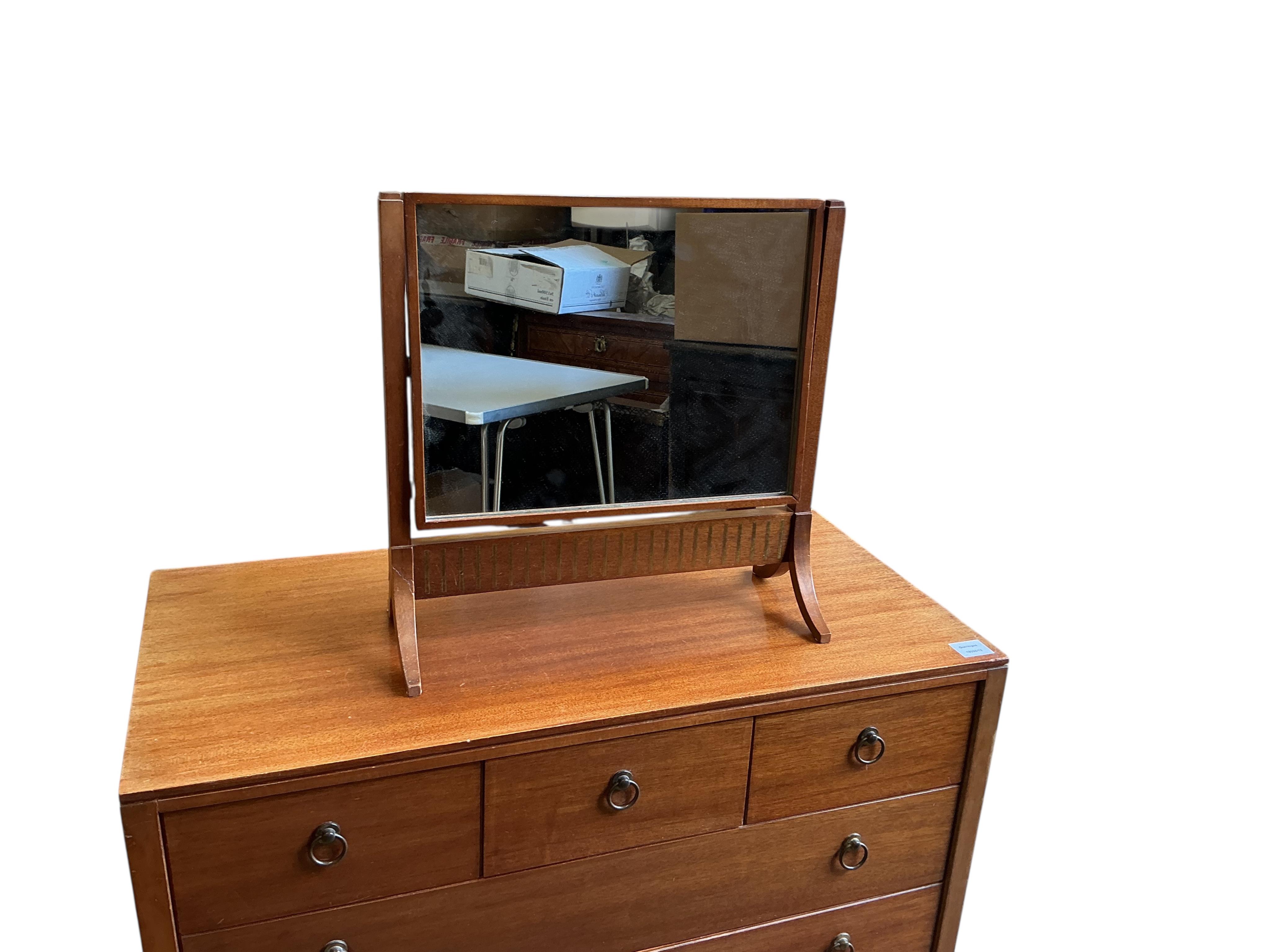 A Loughborough For Heals brass inlaid teak four piece bedroom suite comprising: triple wardrobe, width 120cm, depth 54cm, height 176cm, two chests of drawers and a toilet mirror